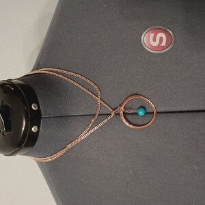 Copper tone blue bead circle pendant necklace